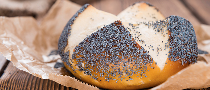 Fresh baked Pretzel Roll with Poppyseed (close-up shot)